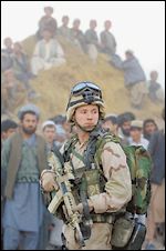 A U.S. Air Force Special Operations soldier near a U.S. Army Special Forces Boeing CH-47 Chinook helicopter. November 15, in Khwaja Bahuaddin, Takhar province [Brennan Linsely, AP]