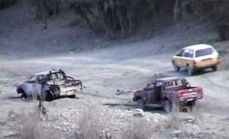 Pickup trucks destroyed by U.S. air strikes near the village of Asmani Kilai